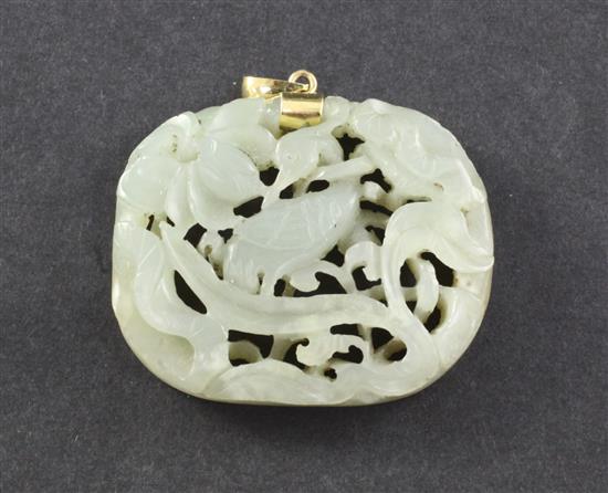 A Chinese celadon jade crane and lotus openwork plaque, Ming dynasty, 4.7cm, later gold mount
